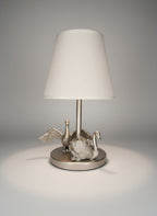 Kinderlampe held in wings of light